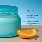 Blue jar labeled 'Volcano' with an orange slice on a blue background