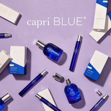 capri BLUE perfume bottles and packaging on a purple background