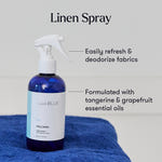 Capri Blue linen spray bottle on a blue towel with text about its uses and ingredients.
