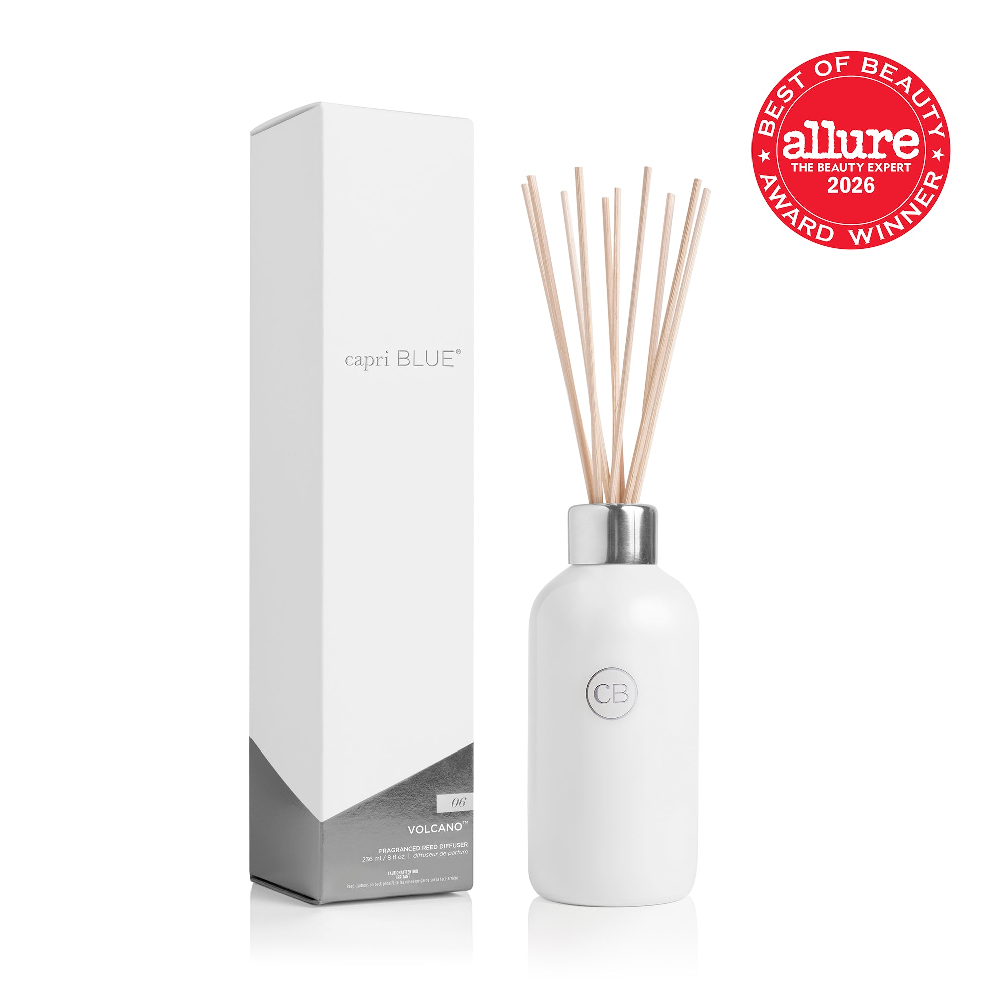 A white reed diffuser bottle with natural wood reeds and a silver collar, shown next to its white and grey packaging box and the Allure 2026 Best of Beauty Award Winner seal.