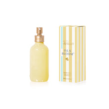 Room spray bottle and packaging of Isla Bloom on a white background