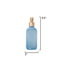 Blue spray bottle with gold nozzle on a white background