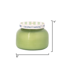 Green candle with a white lid labeled 'Coconut Santal' on a white background
