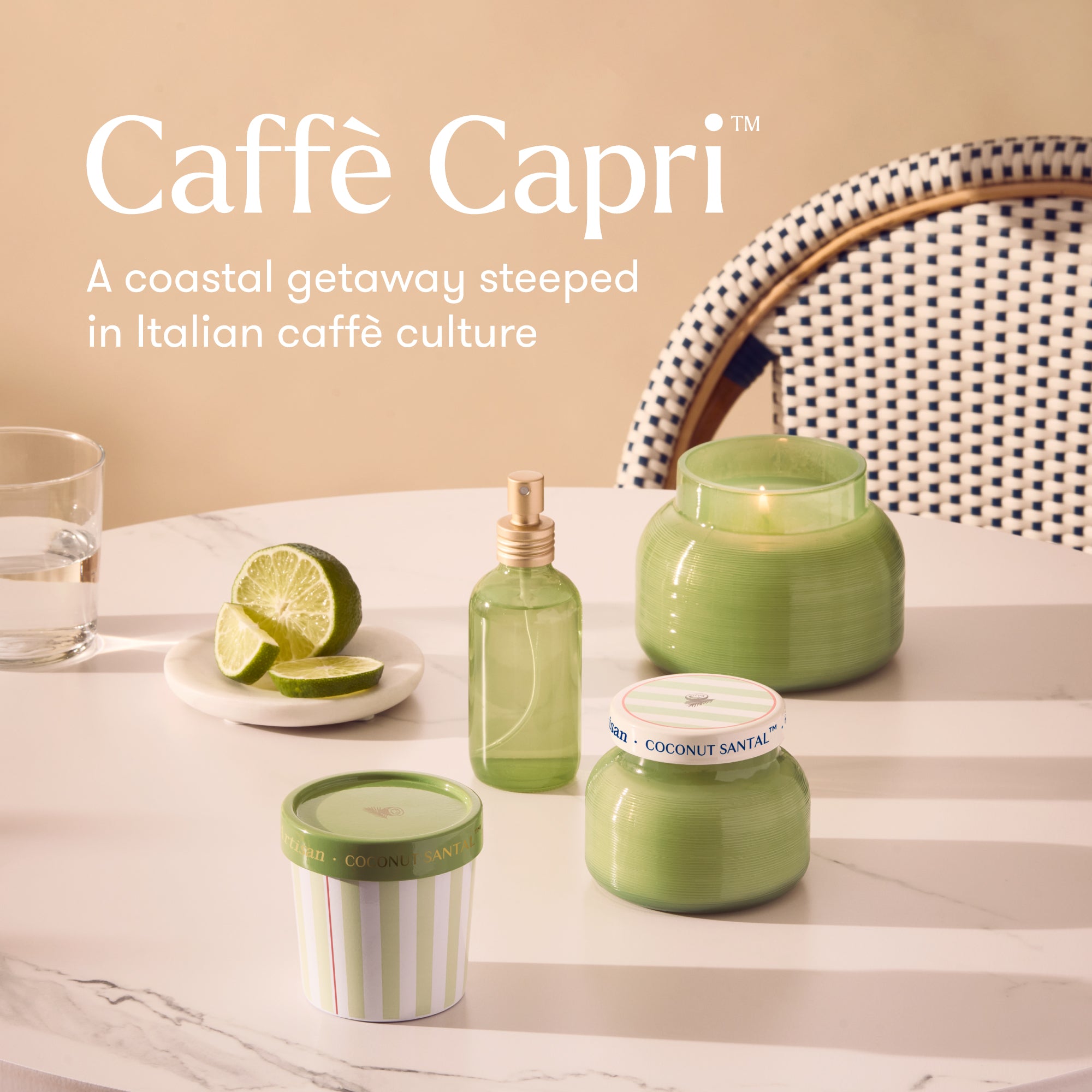 Caffè Capri products including candles and a bottle on a table with a coastal theme.