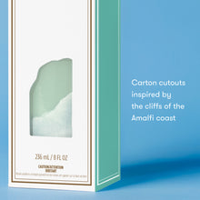 Product packaging with a coastal design on a blue background