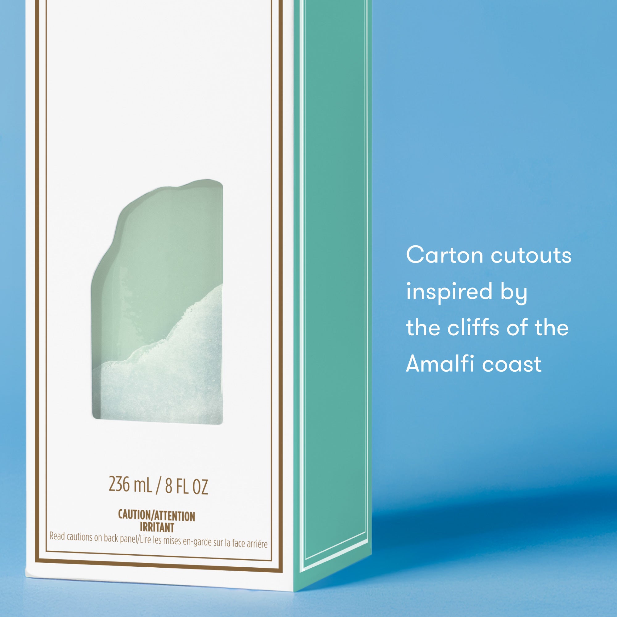 Product packaging with a coastal design on a blue background