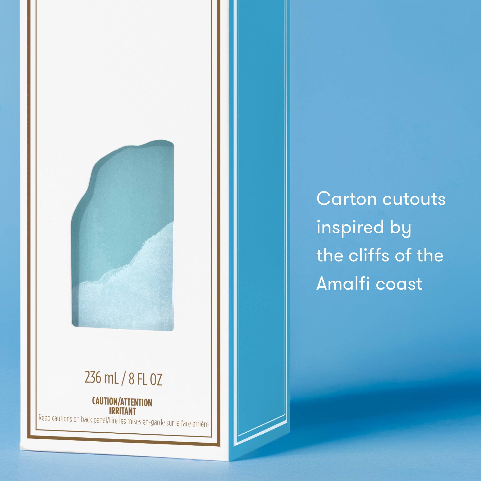 Product packaging with a design inspired by the Amalfi coast on a blue background