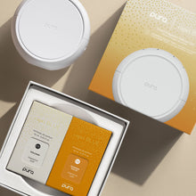 Puro perfume packaging with a box on a beige surface