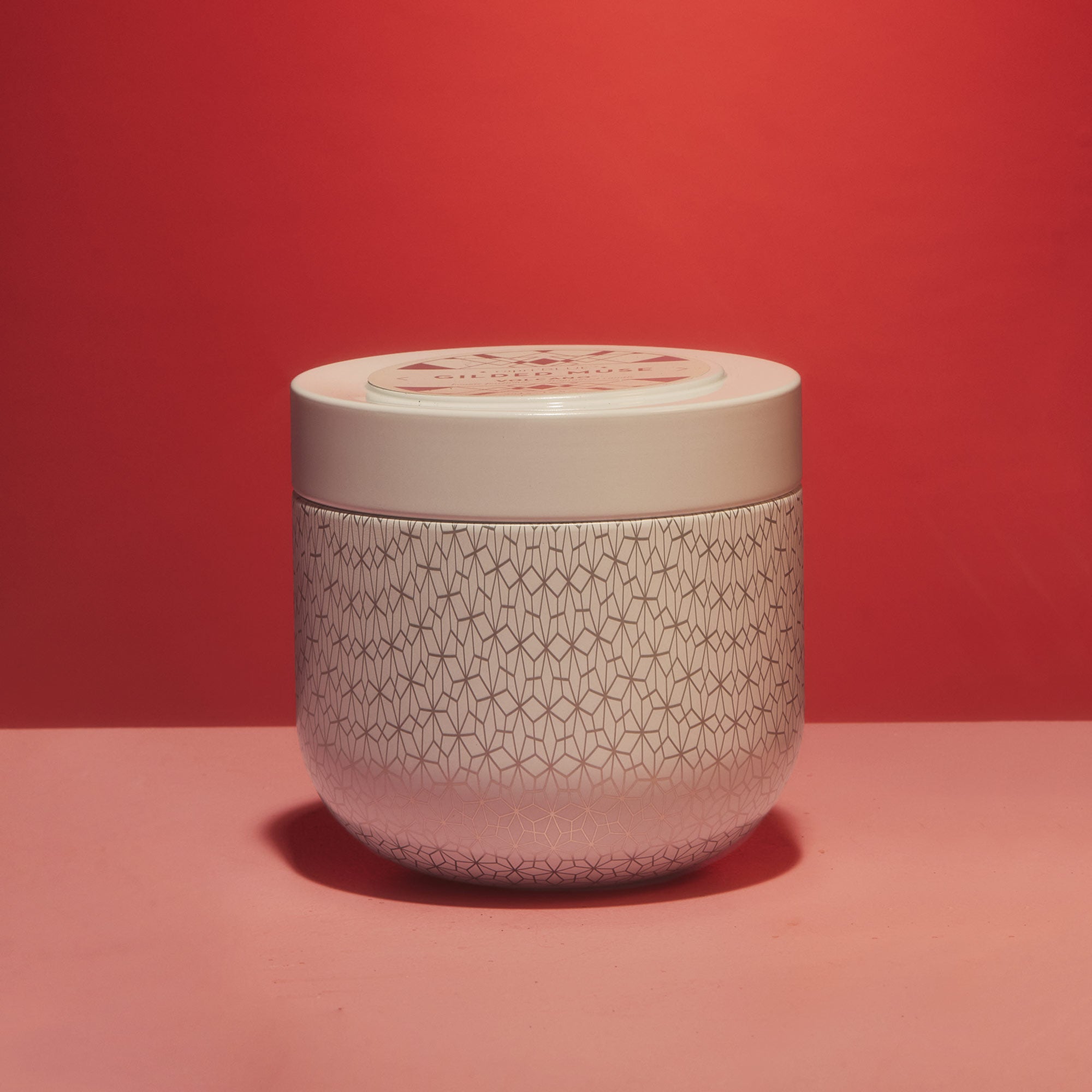 A Capri Blue Volcano Candle Tin in the Gilded Muse finish