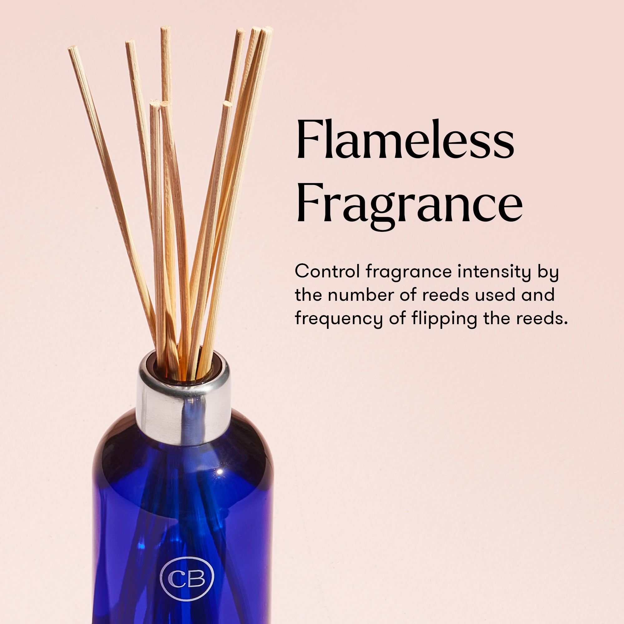 Blue diffuser bottle with reeds on a beige background, featuring the brand 'CB'.
