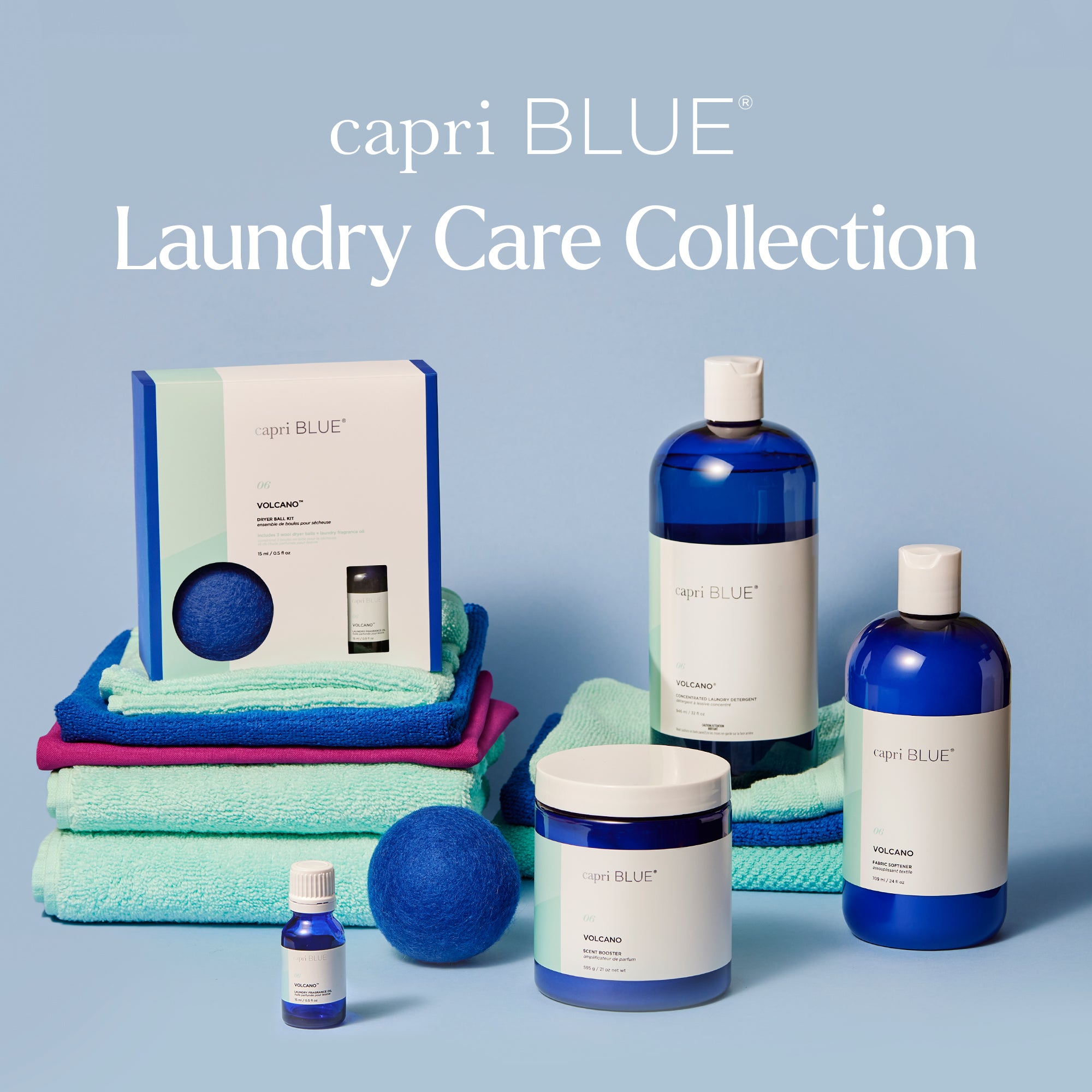 capri BLUE laundry care collection with bottles, towels, and balls on a blue background