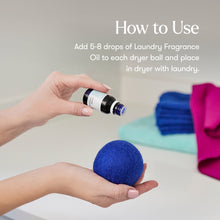 Hand holding a blue dryer ball with a bottle of fragrance oil, text on how to use laundry fragrance oil.