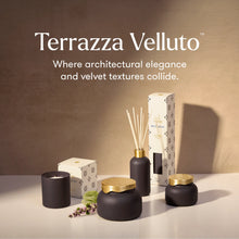 Terrazza Velluto home fragrance collection including a candle, reed diffuser, and jars with gold lids, displayed on a white surface against a textured beige wall with product text overlay.