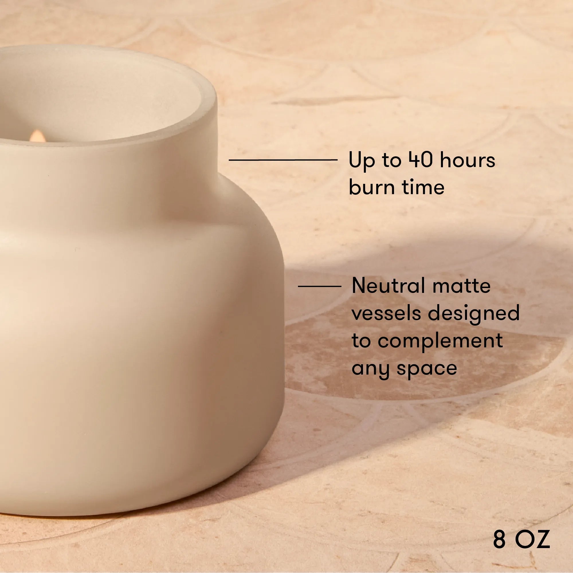 A matte ceramic candle holder or vessel in a warm off-white/cream tone, shown on a beige stone-like surface with text callouts noting up to 40 hours burn time and neutral matte vessels designed to complement any space. '8 OZ' appears in the lower right.