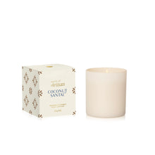 A cream-colored glass jar candle next to its white packaging box with gold and blue text, on a clean white background.