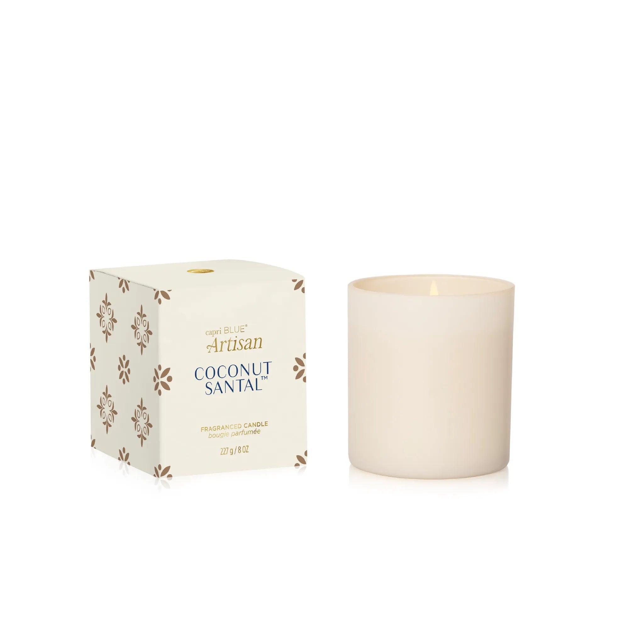 A cream-colored glass jar candle next to its white packaging box with gold and blue text, on a clean white background.