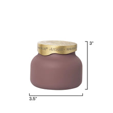 A matte mauve-pink ceramic jar with a textured gold lid, shown with dimension lines indicating a height of 3 inches and a width of 3.5 inches on a white background.