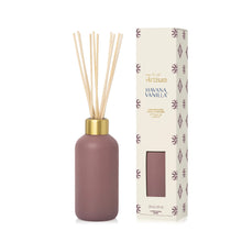 Brown diffuser bottle with gold cap and decorative packaging on a white background