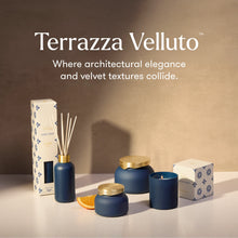 Terrazza Velluto home fragrance collection including a reed diffuser, two candles, and two boxes, styled on a white surface against a warm beige background with the brand name and tagline displayed at the top.