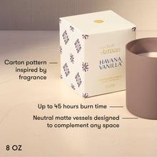 A 8 oz scented candle shown with its white patterned box and a matte taupe candle vessel on a light beige surface. Text on the image highlights the carton design inspiration, up to 45 hours burn time, and neutral matte vessel design.