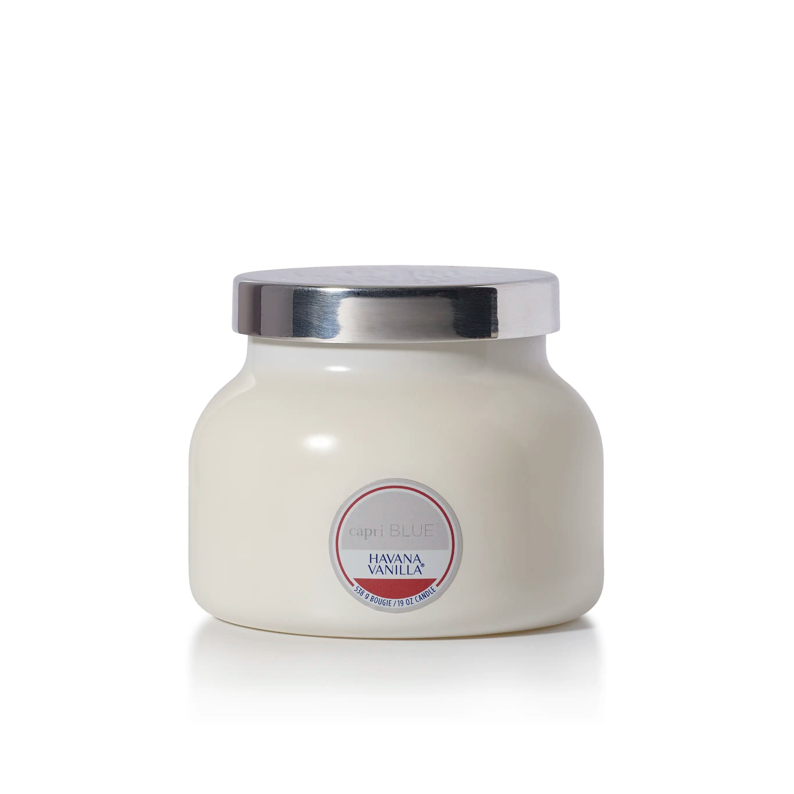 A capri BLUE Candle in a white ceramic jar with a shiny silver metal lid, labeled 'Havana Vanilla' on the front, set against a plain white background.