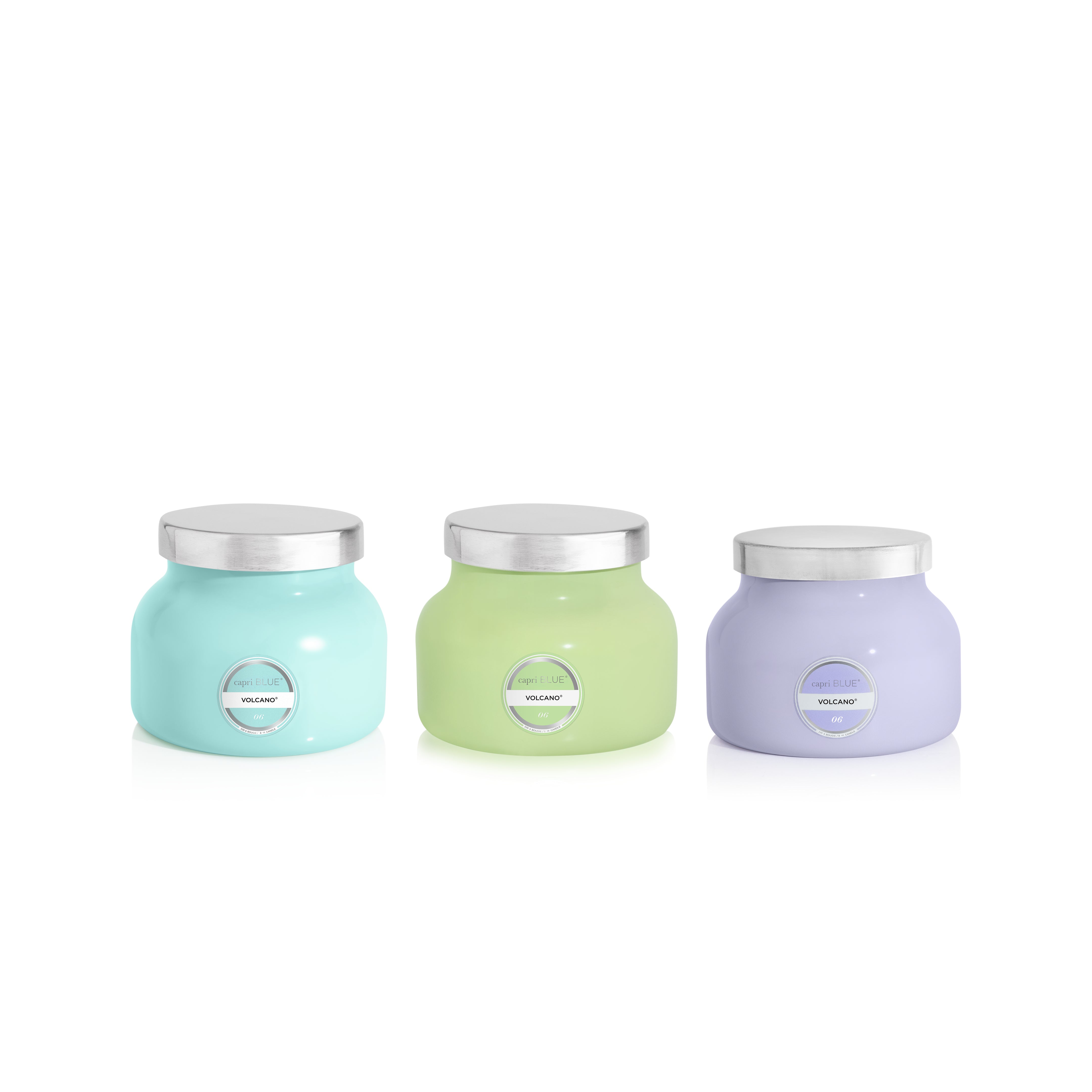 Three pastel-colored jars with silver lids on a white background