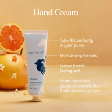 capri BLUE hand cream tube with orange and lemon on a beige background