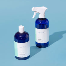 Two bottles of 'Blue' Volcano product on a light blue background