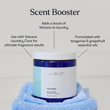 Capri Blue Volcano Scent Booster jar with blue towel on gray background