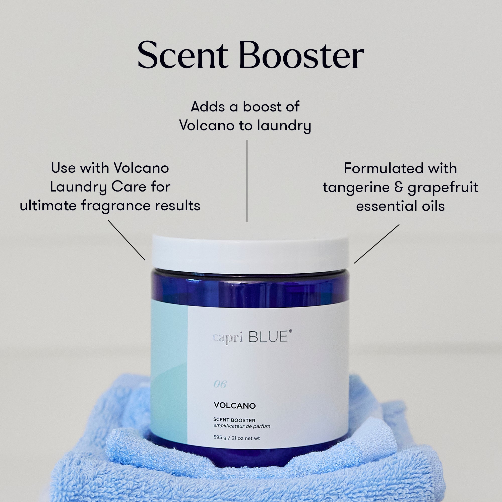 Capri Blue Volcano Scent Booster jar with blue towel on gray background