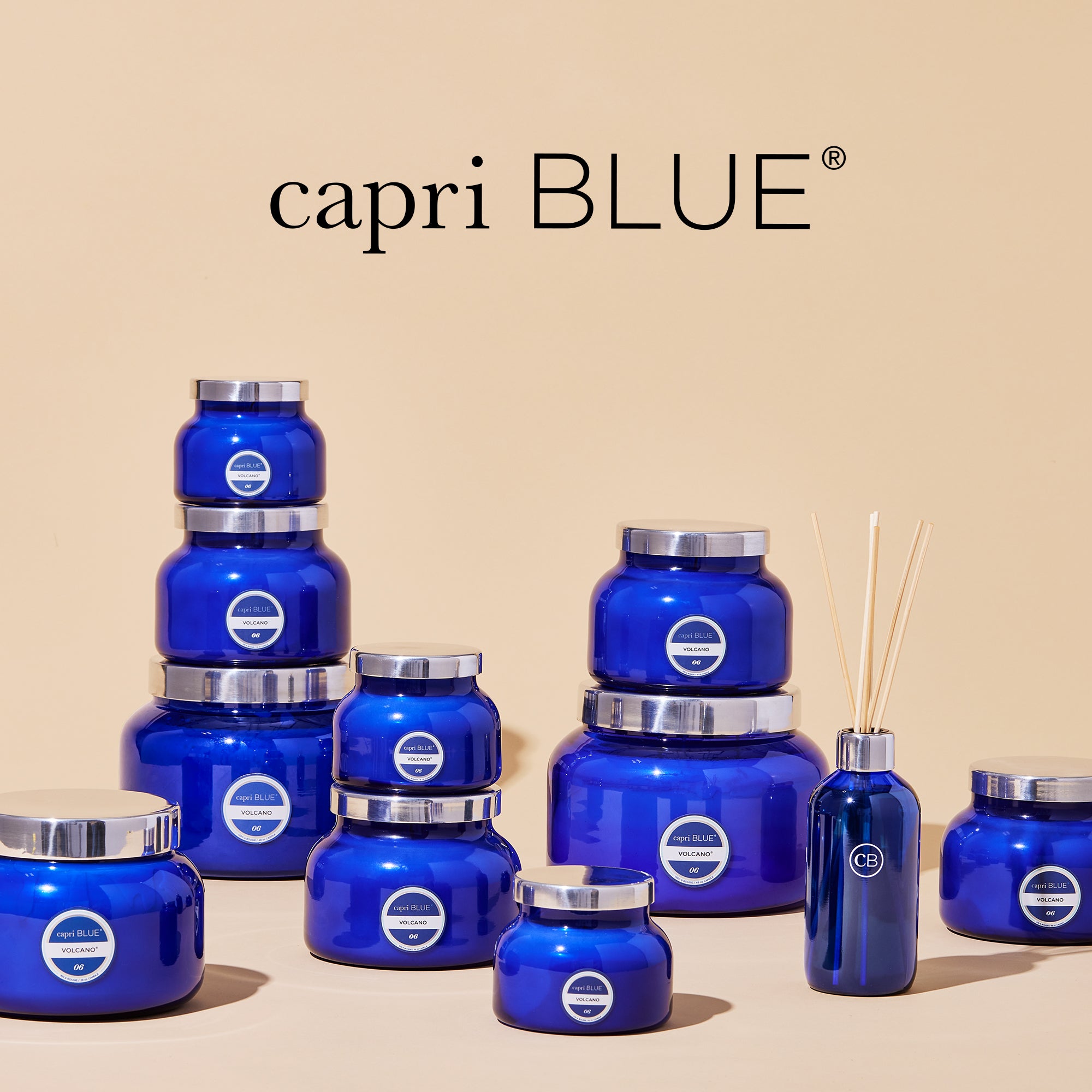 Collection of blue capri BLUE jars and bottles on a beige background