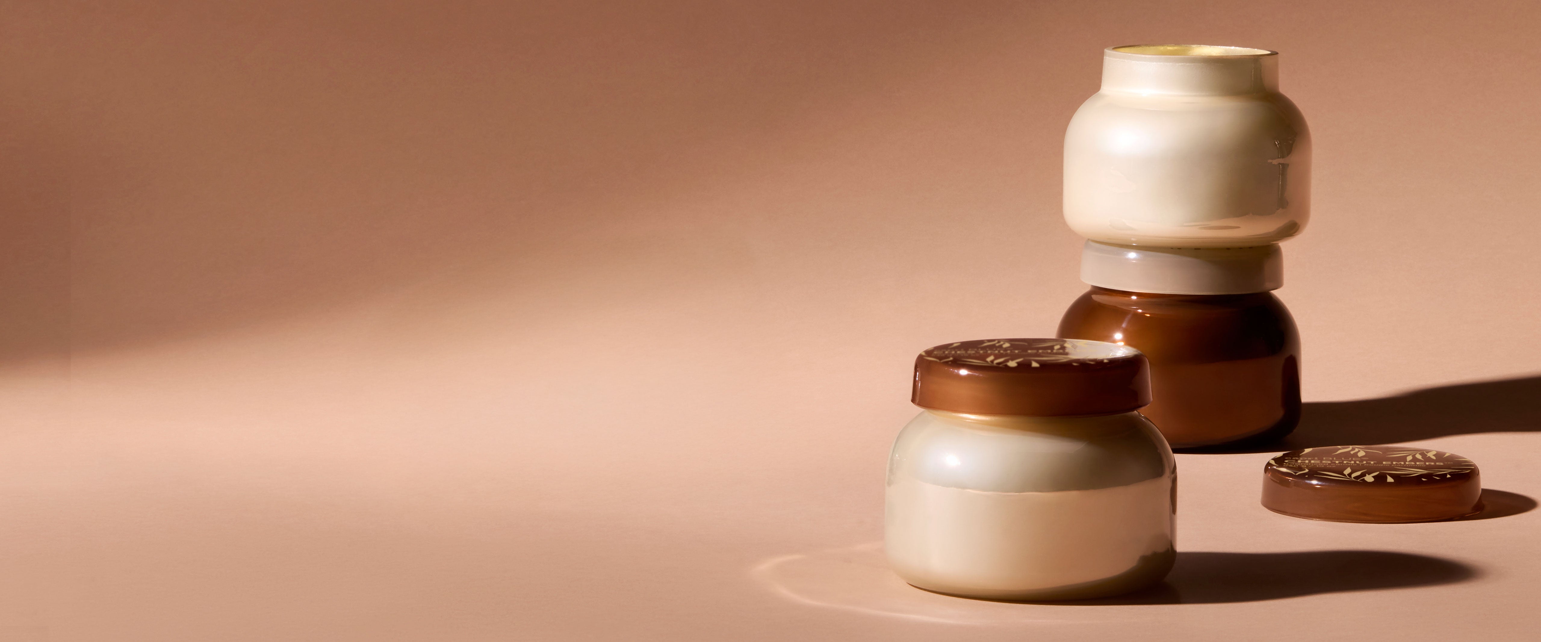 Set of ceramic jars in various sizes on a beige background